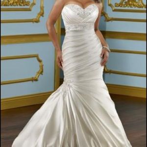 Beautiful original gown purchased from
Bridal boutique and preserved.